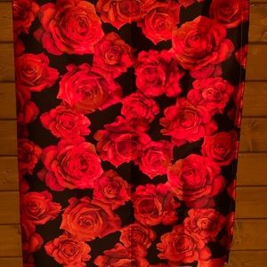 A black curtain with red roses